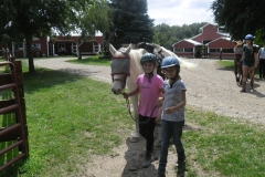 br-girls-leading-a-horse